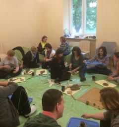 Group of people working with clay