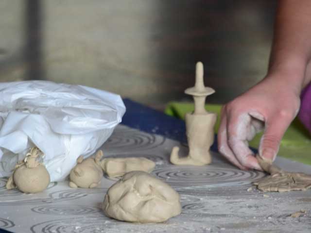 Hand moulding clay pieces
